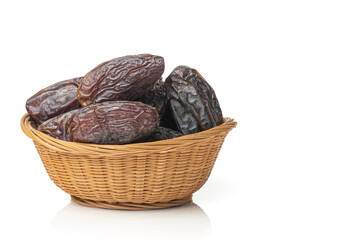 Royal dates in a basket isolated on white background. Copy space.