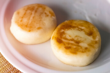 Close-up of cheesecakes on a plate. Homemade traditional Ukrainian and Russian syrniki for breakfast