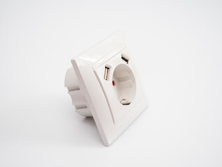 Universal European standard socket with two usb connectors on a white background.