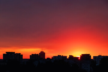 Fototapeta na wymiar Silhouette of city at sunset. Urban landscape at dawn.