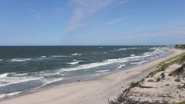 Curonian spit, beautiful vibrant view of Kurshskaya Kosa National Park, Curonian Lagoon and the Baltic Sea, Kaliningrad Oblast, Russia and Klaipeda County, Lithuania, summer day.
