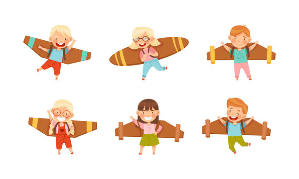 Joyful boys and girls playing pilot with cardboard wings set vector illustration