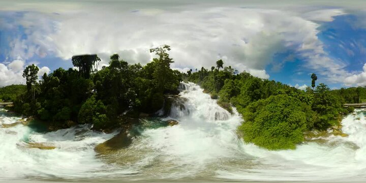 Aerial view of Aliwagwag Falls in a mountain gorge in the tropical jungle, Philippines, Mindanao. Waterfall in the tropical forest. 360 panorama VR.