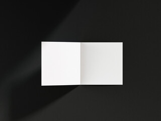 3D illustration. White square bifold flyer isolated on black background