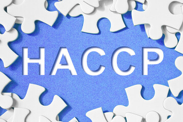 HACCP - Hazard Analysis and Critical Control Points - Food Safety and Quality Control in food industry - concept image in jigsaw puzzle shape