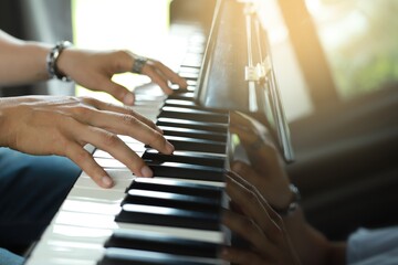 A rocker man plays the piano in the music room at school. favorite classical music Show your...