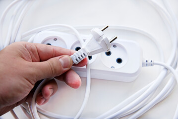 White electric extension cord, great design for any purposes. White background.