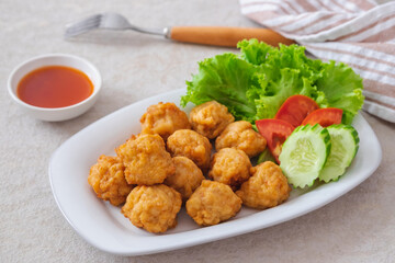Deep fried shrimp ball and vegetable on plate