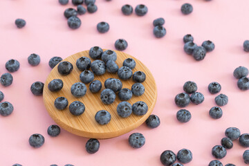 Fresh blueberry on pink background