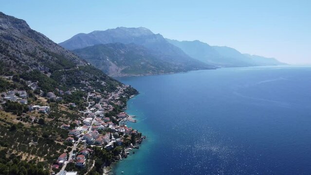 drone flies to the beautiful fishing village of pisak on the Adriatic, cinematic shot (dalmatia, croatia)