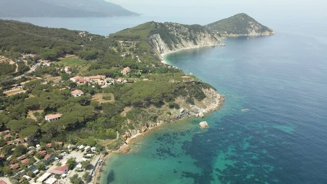 island of elba in italy mediterranean coast aerial images of the beach with turquoise blue waters, flight with drone european tourism green vegetation