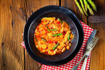 colorful turkey fricassee with asparagus and paprika