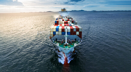 front of Cargo container ship carrying container and running near international custom depot sea...