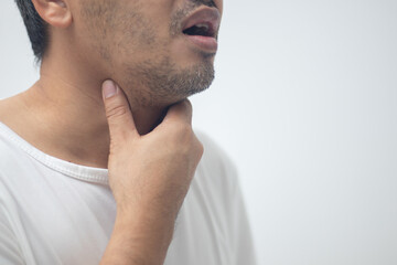 Naklejka premium Man touches throat with his hand, sick with influenza