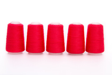 Pink spool of thread isolated on white background. Skein of woolen threads. Yarn for knitting. Materials for sewing machine. Coil.