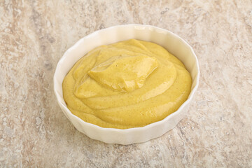 Organic mustard sauce in the bowl