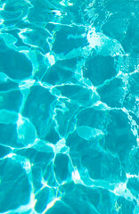 blue color background of swimming pool water with ripples in bermudas