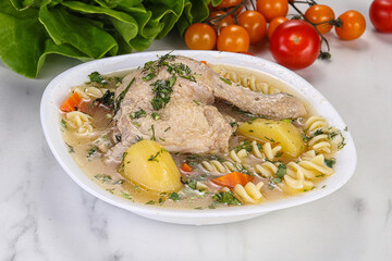 Chicken soup with leg and macaroni