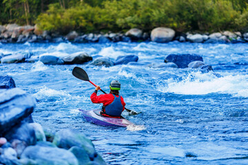 Whitewater kayaking banner, extreme sport rafting. Young woman in kayak sails mountain river