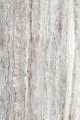 Fototapeta premium Natural stone texture top view. Gray marble, matt surface, Italian slab, granite, ivory texture, ceramic wall floor tiles. Rustic Natural porcelain stoneware vertical background. Limestone pattern.