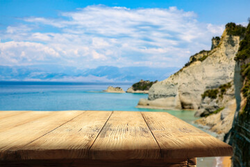 Wooden table with a free space and a beautiful view of the Greek sea