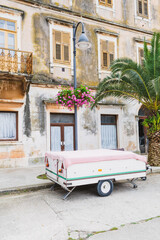 Old street in the town with flowers