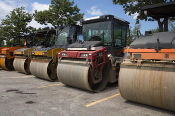 several steamrollers on road construction site heavy equipment asphalt paving roller compactor