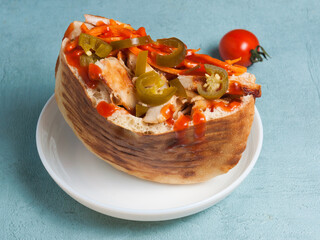 shawarma with chicken, vegetables and jalapeno, poured with ketchup