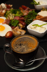 a cup of Americano on the background of food in a cafe
