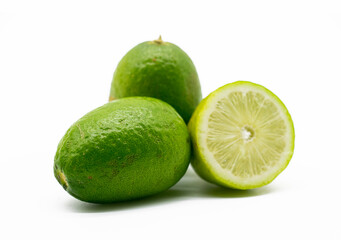 Fototapeta na wymiar fresh whole and slice green Lemons isolated on white background