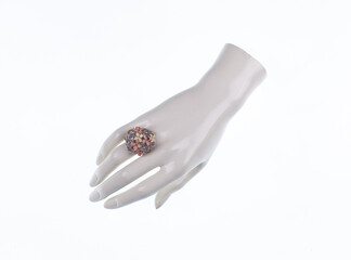 mannequin hand with jewelry ring isolated on white background