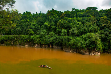 Muddy lake at the base of hills