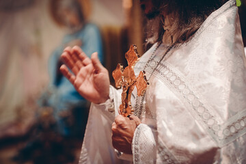 person holding a cross