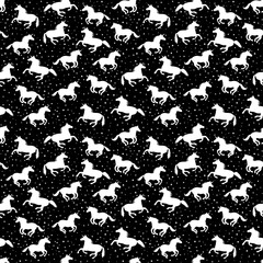 Seamless white unicorn pattern on black background with stars. Print funny for fabric, paper and web.