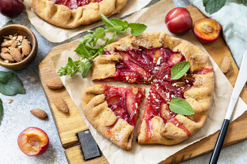 Plum Galette. Healthy homemade wholegrain fruit pie (galette) with plums and almonds, vegan...