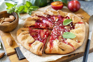 Plum Galette. Healthy homemade wholegrain fruit pie (galette) with plums and almonds, vegan...
