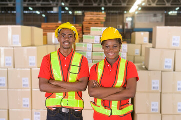 Portrait of mixed race workers wearing helmet in modern warehouse storage of retail shop