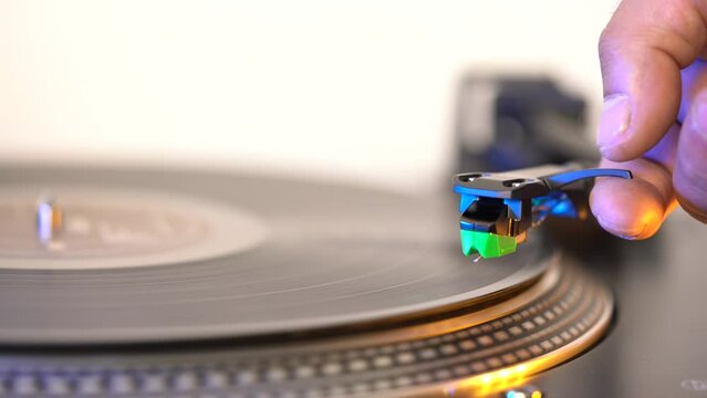 Vintage portable record player playing a old black vynil record