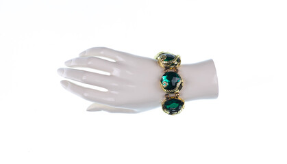 mannequin hand with jewelry bracelet isolated on white background