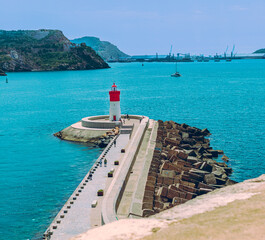 Obraz premium White and red lighthouse in the bay of Cartagena Murcia