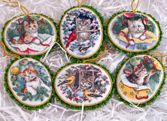 Set of six cross stitched handmade Christmas Tree ornaments. This set is embroidered and made by myself following the design of Dimensions Kitty Keepsake Ornaments