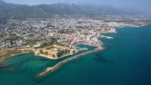 Kyrenia North Cyprus aerial footage harbour castle and entire city is visible with the mountains on the background