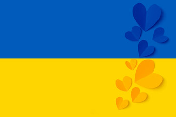 Stop war in Ukraine concept with heart and Ukrainian flag background