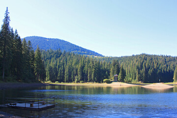 Carpathians Lake Synevyr in sunny day in Ukraine	
