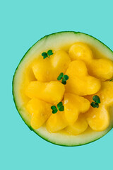 Yellow mini watermelon, Sliced in the shape of a heart, top view, no people, close-up, selective focus,