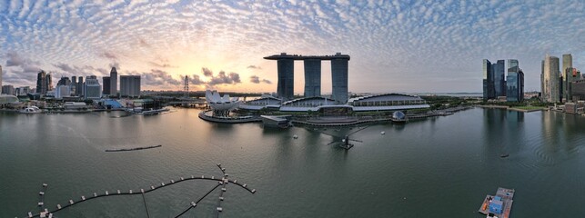 Fototapeta premium Aerial View of The Picturesque Marina Bay Sands Casino and Hotel, The Shoppes, Singapore Flyer and the Art MuseumAerial View of The Picturesque Marina Bay Sands Casino and Hotel, The Shoppes, Singapor