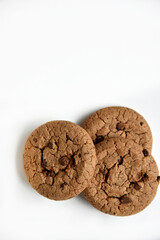 Oatmeal cookies with chocolate chips on a white background. Cookies are delicious close-up.
