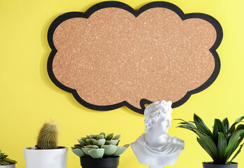 gypsum statue and plants with blank sign on yellow background. copy space, advertisement, presentation. New ideas, creativity and think out of the box