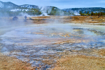 Yellowstone in winter with thermal pools of alkaline waters