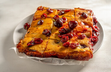 Fresh baked sweet cherry pie or red brownie cake on plate close up
